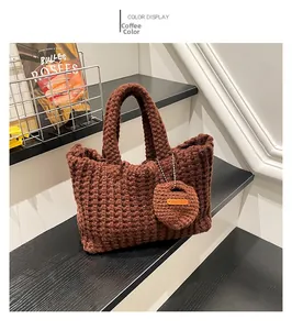 Close-up of handmade coffee brown woven knit bag with round coin purse detail