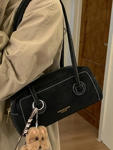 Retro black suede crossbody bag for women with white contrast stitching and bear charm