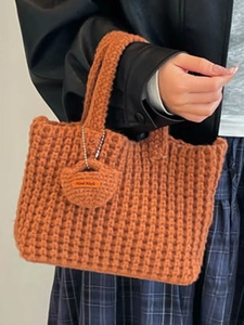 Caramel hand-crocheted woven tote bag with a mini handmade charm and soft texture