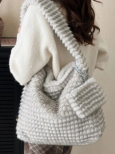 Minimalist soft plush cloud tote bag with pleated fur texture and small matching pouch
