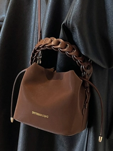 Chic brown leather bucket bag with woven handle and drawstring closure for women