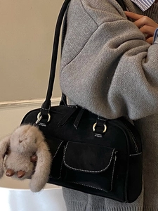 Vintage black underarm tote bag with white stitching and cute rabbit charm for winter 2025