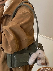 Retro olive green suede shoulder bag with dual pockets and plush rabbit charm