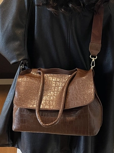Minimalist brown crocodile pattern tote bag with wide strap for stylish commuting