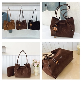 Detail of suede tote bag with floral charm, wooden beads and inner zipper pouch