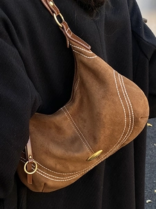 Brown vintage suede hobo bag with white stitching and bronze hardware detail