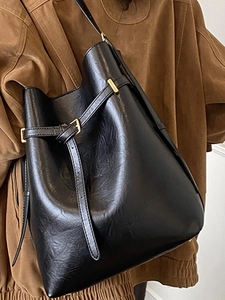 Minimalist black leather bucket bag for women with gold buckle and large capacity strap