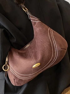 Retro coffee suede hobo bag with contrast stitching and golden hardware on shoulder