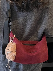 Minimalist burgundy suede tote bag for women with an adjustable strap and cute bear charm