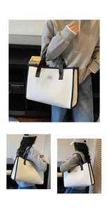 Detail of the large checkered tote bag showing contrasting handles and side strap view