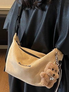 Minimalist beige corduroy tote bag with embroidery and plush bear charm for winter