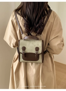 Detail of vintage color-block backpack with adjustable straps and textured PU leather