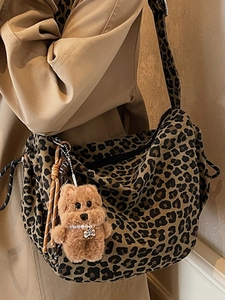 Leopard print canvas shoulder bag with plush dog charm and large capacity moon shape