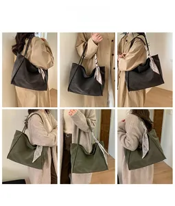 Detailed look at large tote bags in black and olive green with decorative silk scarves