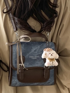 Retro canvas and leather拼接 backpack with plush dog charm in vintage aesthetic style