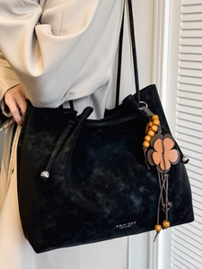 Minimalist black suede tote bag with flower wood bead charm and thin straps