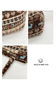 Detail of plush lamb wool tote bag featuring patchwork heart and floral patterns