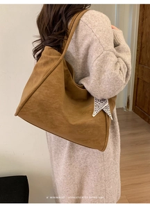 Brown retro tote bag with suede texture featuring an elegant patterned silk scarf detail