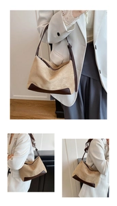 Close-up of vintage brown suede shoulder bag with leather straps and zip closure
