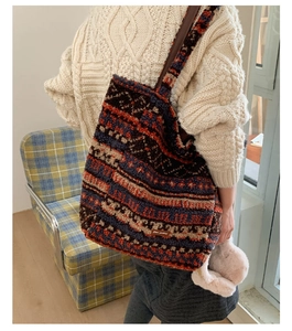 Detail of plush tote bag featuring vintage geometric jacquard and leather shoulder straps