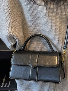 Vintage black leather crossbody bag for women with gold clasp and elegant hand strap