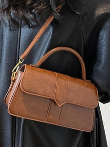 Retro brown PU leather crossbody flap bag with V-shaped trim and gold hardware