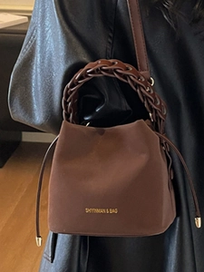 Brown suede bucket bag with leather braided handle and drawstring closure for women