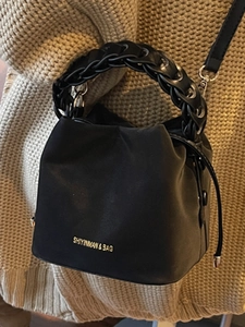 Chic black bucket bag with woven rope handle and drawstring closure for women