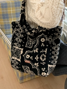 Star-picking plush tote bag with black and white ethnic pattern and leather tag