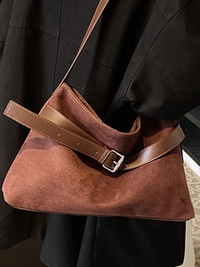 Brown vintage faux suede tote bag with leather buckle detail and spacious interior