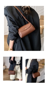Detail showing brown pebble leather texture and golden magnetic buckle on the crossbody bag