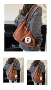 Close-up of brown knit shoulder bag with cute cartoon puppy patch and chunky yarn texture