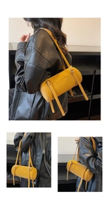 Detail of mustard yellow cylinder bag featuring adjustable leather strap and silver buckles