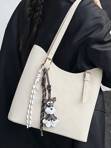 Minimalist off-white large capacity tote bag with adjustable straps and dog charm