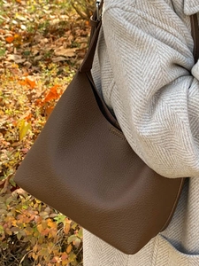 Minimalist dark brown litchi grain leather bucket bag for autumn winter fashion outfit