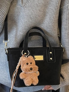 Fashionable black faux suede tote bag for women with golden hardware and cute bear charm