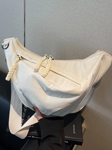 Chic off-white crescent hobo bag with pleated texture and adjustable strap for women