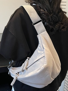 Chic cream white crescent crossbody bag for women with adjustable strap and braided zipper