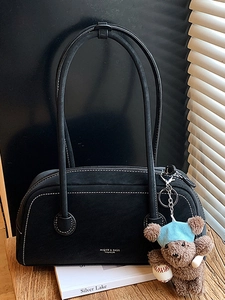 Vintage black frosted shoulder bag with white stitching and bear plush charm