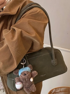 Dark green matte underarm bag for women with a cute brown plush bear charm accessory