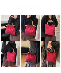 Detailed views of red embroidered handbag with bamboo handles on fashion models