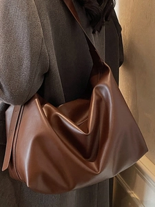 Minimalist large dark brown hobo shoulder bag in soft leather finish for women