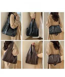 Détails du grand sac cabas vintage en noir et marron avec une bandoulière
