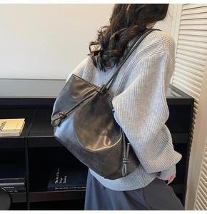 Retro large capacity tote bag with chunky knot shoulder strap detail in dark gray matte leather