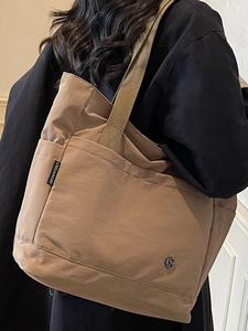 Khaki large nylon tote bag with wide strap for casual daily use and commuting