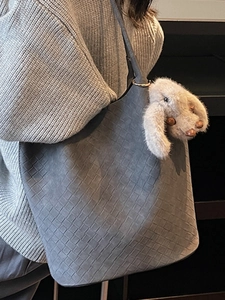 Minimalist dark gray woven texture tote bag with a plush rabbit pendant for winter
