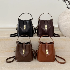 Minimalist vintage bucket bags in four colors with gold metal locks and top handles