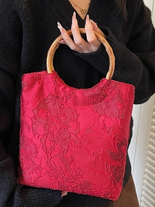 Elegant Chinese red silk tote bag with peony patterns and natural bamboo handles