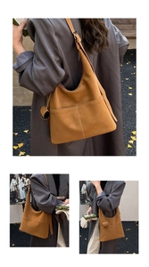 Detail of brown hobo bag with white stitching shown on a model in autumn street setting
