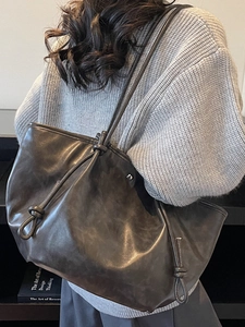 Large vintage leather tote bag with knotted strap detail for minimalist casual commuting
